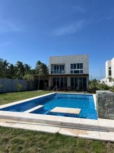 a swimming pool in front of a house at Venice House, Costa del Sol in San Luis La Herradura