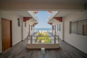 a hallway of a building with a view of the ocean at Grand Casalet in Puerto Escondido
