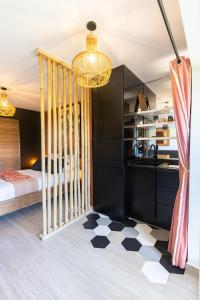 a bedroom with a black and white checkered floor at Village Soleil in Le Gosier