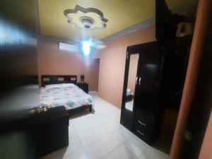 a bedroom with a bed and a dresser in it at Garcias Suites Cuauhtémoc in Linares +10 photos