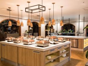 a kitchen with pots and pans on a counter at Mercure Sydney in Sydney