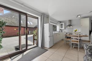 a kitchen and dining room with a large window at 2 Bed in Alkham oc-p34785 in Swingfield