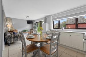 a kitchen and dining room with a table and chairs at 2 Bed in Alkham oc-p34785 in Swingfield +11 photos