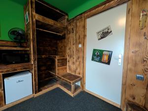 a room with a wooden cabin with a stair hesitate at Planinski dom Janče in Ljubljana