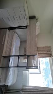a bedroom with a bunk bed and a window at Oppheim apartment, shared Pool & Sauna in Vossevangen +19 photos