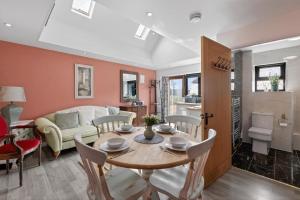 a living room with a table and a couch at 1 Bed in Alkham oc-s34788 in Swingfield