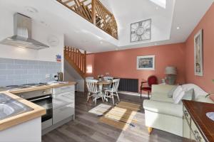 a kitchen and living room with a couch and a table at 1 Bed in Alkham oc-s34788 in Swingfield