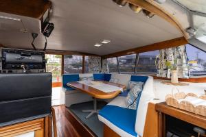 a dining area of a boat with a table in it at Classic Seadream Yacht in Figueira da Foz