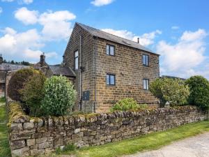 an old brick house with a stone wall at 3 Bed in Matlock oc-86482 in Cuckney