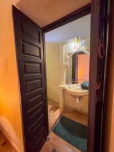 a bathroom with a sink and a mirror at Riad Sidi Hicham in Marrakesh +59 photos