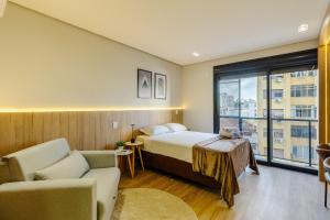 a hotel room with a bed and a window at Soul República - Cidade Baixa in Porto Alegre +155 photos