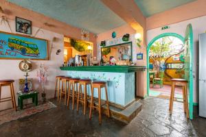a bar with bar stools in a room at Erofili Rooms in Agia Galini