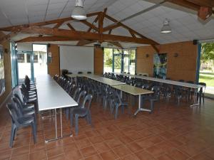 a conference room with tables and chairs and a whiteboard at Cozy Cottage Retreat for Two in Moutiers-sous-Chantemerle +24 photos