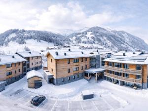 an aerial view of a resort in the snow at Spacious suite for 8 guests with a private sauna in Rauris
