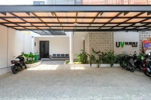 a group of motorcycles parked inside of a building at Urbanview Hotel Subali Purwokerto in Purwokerto