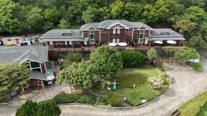 an aerial view of a large house with a garden at Yosemite Park B&B in Ren'ai