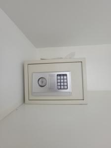 a microwave on a wall in a room at Swan cottages #6 Waterfront in Providenciales +13 photos