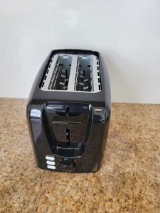 a black toaster sitting on top of a counter at Swan Cottages #5 Waterfront in Providenciales