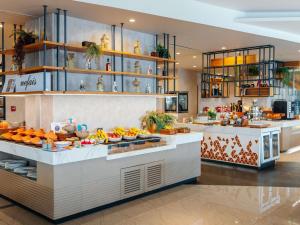 a buffet in a restaurant with a lot of food at Novotel Istanbul Zeytinburnu in Istanbul +137 photos