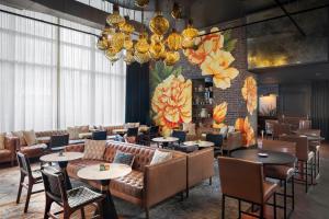 a restaurant with couches and tables and chairs at The Westin Cleveland Downtown in Cleveland