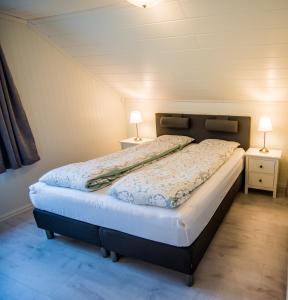 Ένα ή περισσότερα κρεβάτια σε δωμάτιο στο Viken Holiday Home