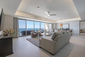 a living room with a couch and chairs and a table at NEW Sonoran Star Luxury condo 2BD, 2BA in Puerto Peñasco