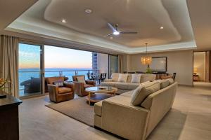 a living room with a couch and chairs and a table at NEW Sonoran Star Luxury condo 2BD, 2BA in Puerto Peñasco