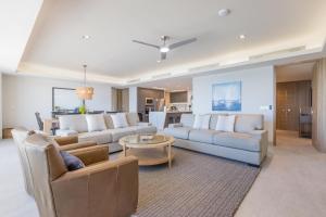 a large living room with couches and a table at NEW Sonoran Star Luxury condo 2BD, 2BA in Puerto Peñasco
