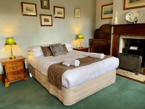 a bedroom with a bed with two towels on it at Whites Corner in Bothwell