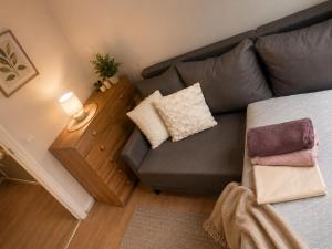 a living room with a couch and a table at DalkoskaStreet in Gniezno