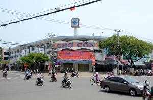 a group of people riding motorcycles in front of a building at Pawseas Homestay in Danang
