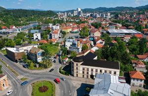 an aerial view of a town with a city at Urban Nest Tuzla in Tuzla