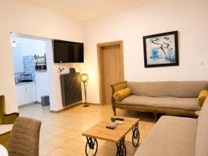 a living room with a couch and a table at Navigo house Vrachati in Vrachati