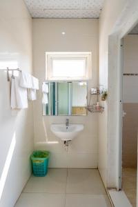 a bathroom with a sink and a mirror at Khách sạn SIC Quảng Bình in Dong Hoi +43 photos