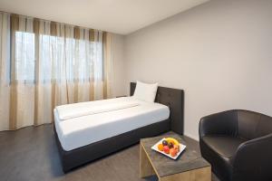 Postel nebo postele na pokoji v ubytování Aparthotel-aarau-WEST Swiss Quality