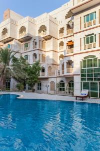 Bazén v ubytování Muscat Oasis Residences nebo v jeho okolí