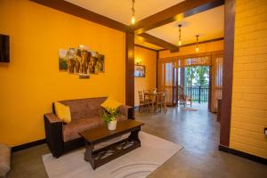 a living room with a couch and a table at Cinnamon View Galle in Galle