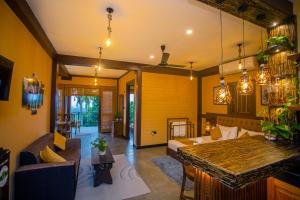 a living room with a table and a dining room at Cinnamon View Galle in Galle +75 photos