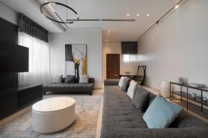 a living room with a couch and a table at 108 Opebi Executive Apartments in Lagos