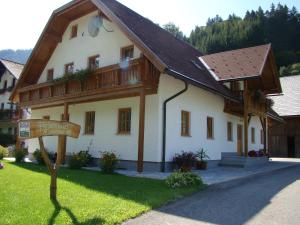 a large white building with a wooden roof at Ferienhaus Ehrenreith in Göstling an der Ybbs