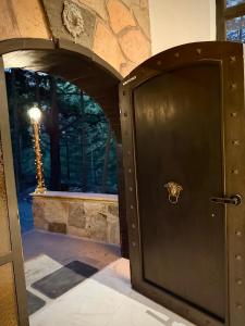 a wooden door in a room with a window at Mansionality Group in Tlalpujahua de Rayón