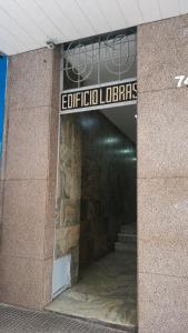a entrance to a building with a sign on it at Studio no Centro com Wi-Fi in Manaus