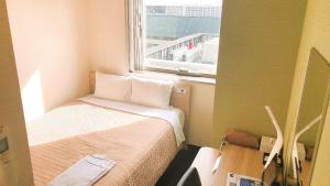 a small room with a bed and a window at Meet Inn Narita in Narita +19 photos