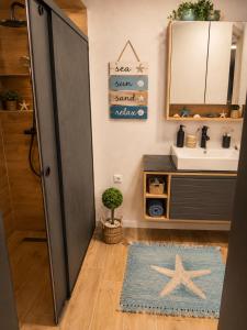 a bathroom with a sink and a mirror at Casa M in Kranevo +4 photos