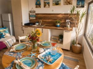 a kitchen with a table with blue plates on it at Casa M in Kranevo