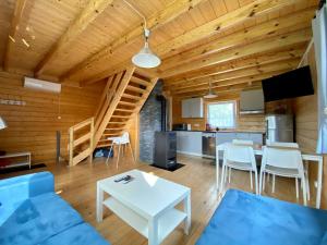 a living room with a blue couch and a table at Przystanek Wyspa in Gdańsk