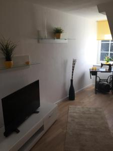 TV a/nebo společenská místnost v ubytování Ferienwohnung Giese