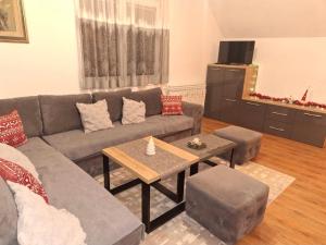 a living room with a couch and a table at Kuca Kosta in Pale