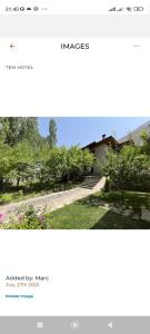 a screenshot of a website of a yard with a house at Tem Hotel in Khorog