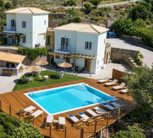 an image of a villa with a swimming pool at LausAndros Suites in Andros